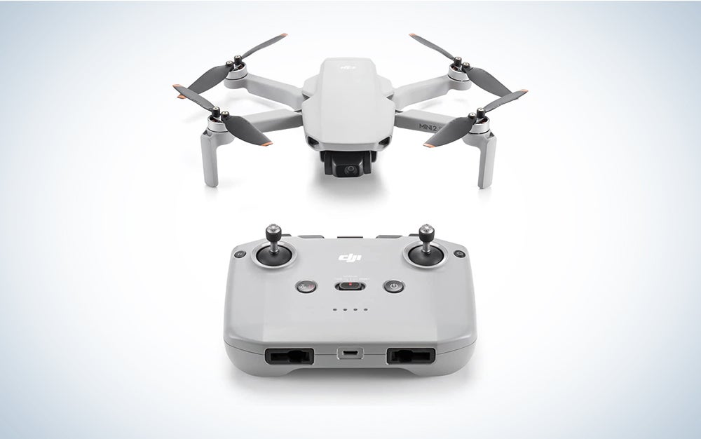A DJI Mini 2 SE drone on a blue and white background
