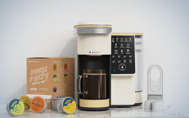 A Bruvi coffee bundle consisting of a machine and B-pods on a kitchen counter